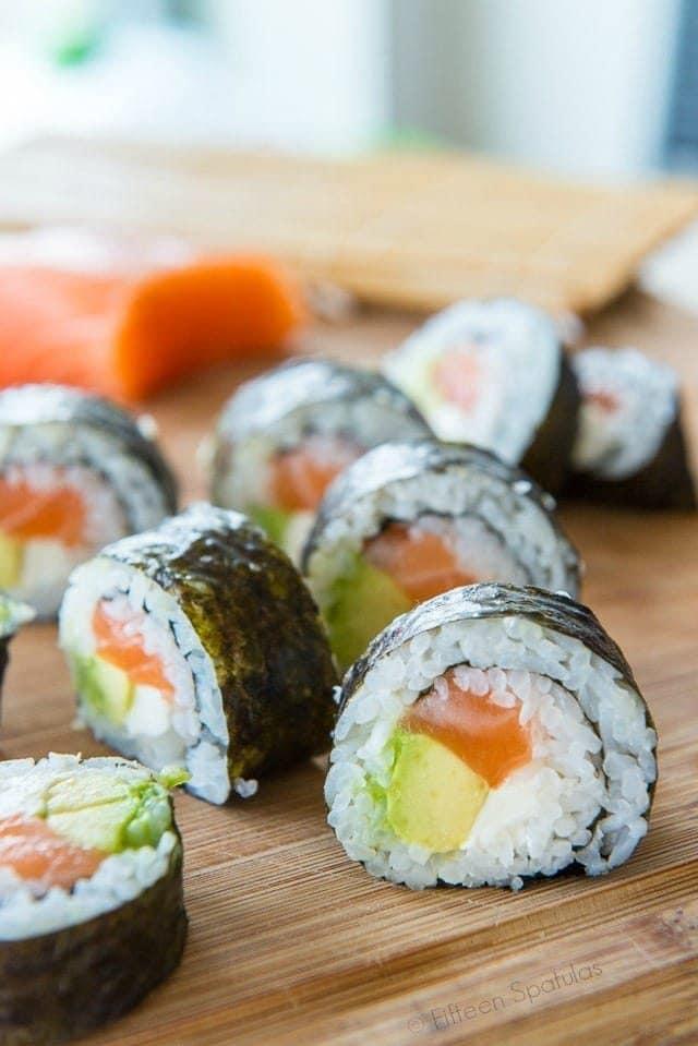 Sushi Rolls - Sliced and Laid on Wooden Board